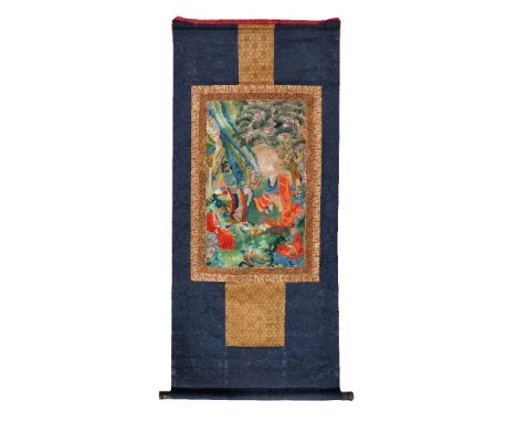 An embroidered silk Thang-ka depicting an Arhat, Tibet, 19th/early 20th century, the Buddhist teacher depicted seated in a wo