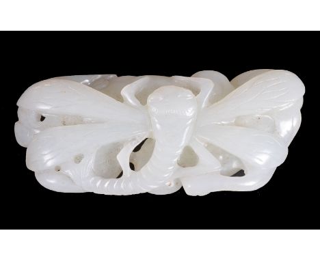 A Chinese white jade 'Dragonfly' carving, late Qing Dynasty, of even white tone, carved with four wings and resting on fruits