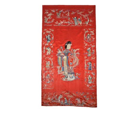 A large Chinese red silk panel, Qing Dynasty, late 19th century, depicting Magu the Taoist goddess, holding a flower basket i