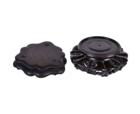 A good Chinese hardwood stand, possibly Zitan, with five pierced ruyi head shaped carvings, 18cm wide, 467 grams and another 
