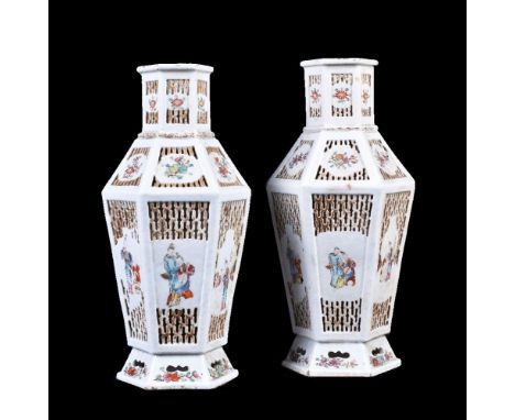 A pair or Chinese 'Famille Rose' reticulated hexagonal vases, Qing Dynasty, late 18th-early 19th century, painted with figure