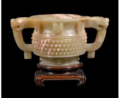 A Chinese celadon and white jade two handled cup, Qing Dynasty, 19th century or earlier, carved after the archaic gui form, t