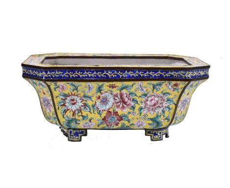 A Chinese enamel yellow-ground jardinière, Qing Dynasty, with elegant floral meander of pink and blue peony blooms borne on s