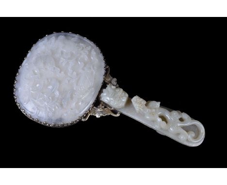 A Chinese white and celadon jade silver-mounted hand mirror, Qing Dynasty, 19th century, the handle a pale celadon garment ho
