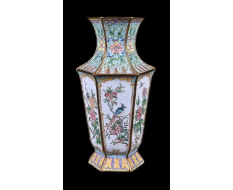 A Chinese canton enamel hexagonal vase, 19th century, the tapering body featuring reserves of alternating birds and flowers, 