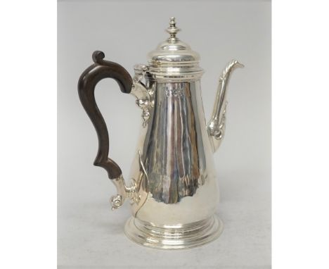 A late George II silver small coffee pot, of tapered form with a turned finial and raised on a circular foot, fitted with a l