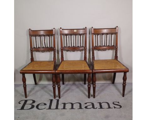 A set of six early 19th century Anglo-Indian teak framed dining chairs with bobbin and split bullseye decoration, on turned s