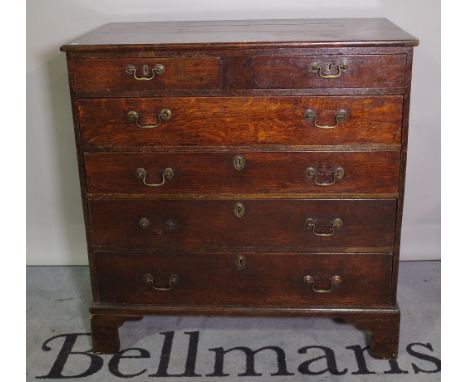 A George III oak chest of two short and four long graduated drawers, on bracket feet, 96cm wide x 109cm high. 