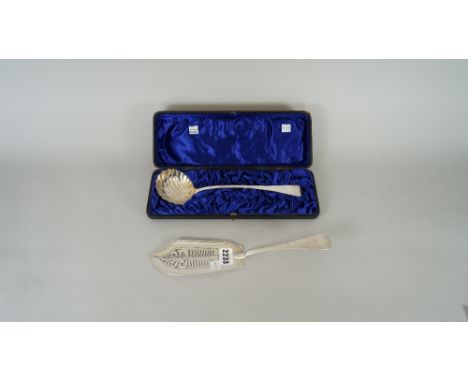 A silver Old English pattern fish slice, with pierced decoration, London 1824 and a silver Old English pattern soup ladle, ha