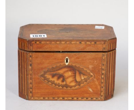 A George III mahogany tea caddy of compressed octagonal form with twin lidded interior, 19cm wide x 12cm high. 