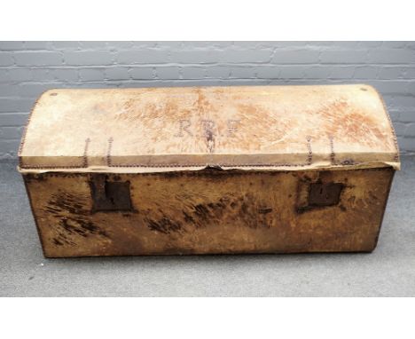 An 18th century brass studded horsehide upholstered dome top pine trunk, 130cm wide x 57cm high. 
