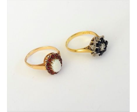 An 18ct gold sapphire and diamond hexagonal cluster ring, claw set with the principal circular cut diamond in a surround of s