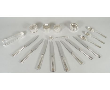 Silver and silver mounted wares, comprising; four napkin rings, a pair of fiddle pattern sugar tongs, Sheffield 1893, a condi