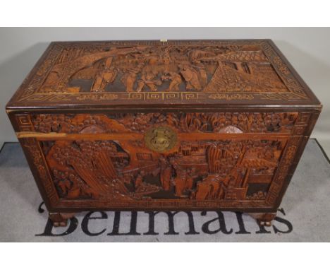 A 20th century Chinese carved hardwood trunk, 110cm wide x 70cm high, (a.f.). 
