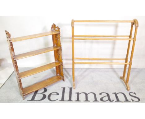 A late Victorian stained beech towel rail, 70cm wide x 82cm high and a Victorian oak fret cut four tier hanging shelf 55cm wi