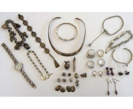 Mostly silver jewellery, comprising; a curb link charm bracelet, on a heart shaped clasp, four further bracelets, an Accurist