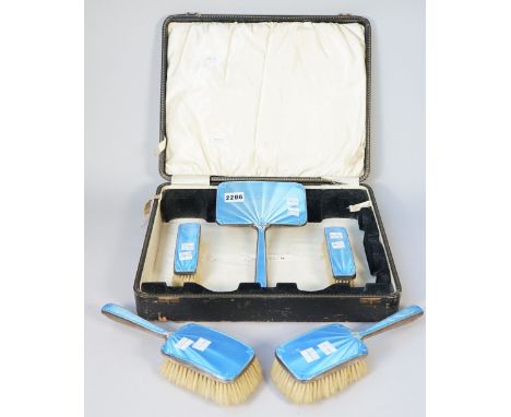 A group of mostly silver and blue enamel mounted lady's dressing table wares, comprising; two hair brushes and two clothes br