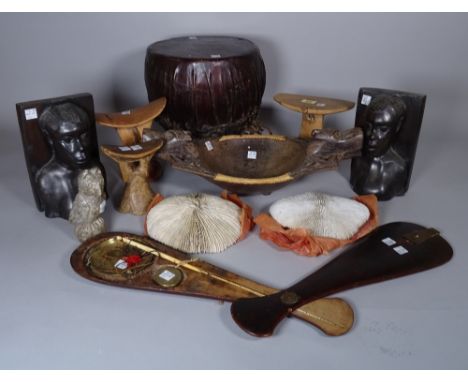 Tribal interest, including; a group of three headrests, a pair of hardwood bookends, 21cm high, a twin handled bowl, 43cm wid