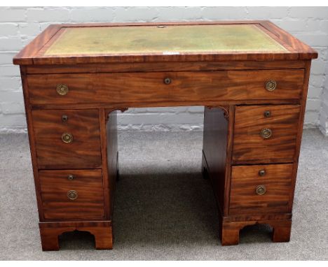 A George III and later mahogany writing desk, the angle adjustment top over five drawers, on bracket feet, 94cm wide x 75cm h