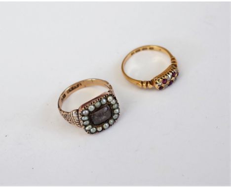 A Victorian 18ct gold, ruby and diamond ring, mounted with five cushion shaped rubies alternating with five cushion shaped di