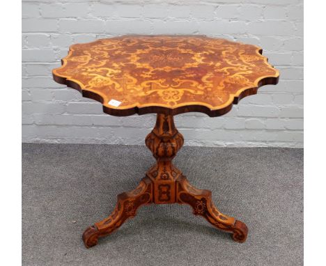 A 19th century Italian marquetry inlaid rosewood occasional table with shaped top on hexagonal baluster column and tripod bas