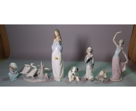 A group of ceramic figures including, Nao, Lladro and sundry, the tallest 35cm (7). 