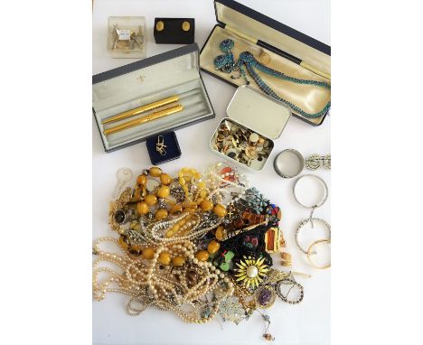 A group of costume jewellery, including bead and other necklaces, brooches, imitation pearls, studs cufflinks and further ite