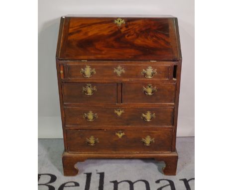 A 19th century mahogany bureau with two short and two long drawers on bracket feet, 70cm wide x 97cm high. 