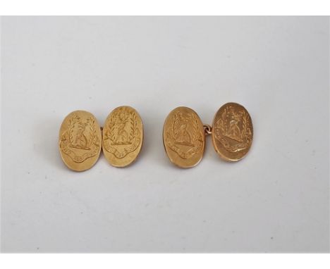 A pair of 9ct gold cufflinks, the oval backs and fronts engraved with crests and mottos, Birmingham 1934, weight 11.3 gms.