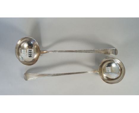 A George III silver bottom marked, feather edged, Old English pattern soup ladle, circa 1790 and a George III single struck, 