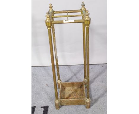 A Victorian brass four division stick stand, 23cm wide x 62cm high. 