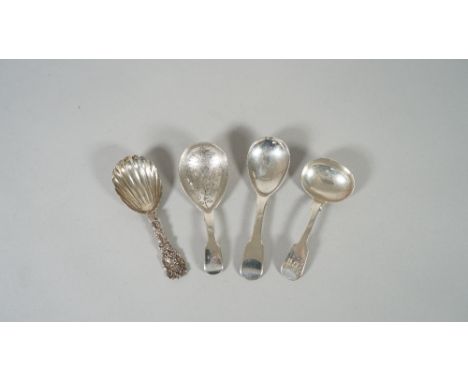 A Victorian silver caddy spoon, having a shell shaped bowl, the single struck handle cast with fruiting vine, London 1873 and