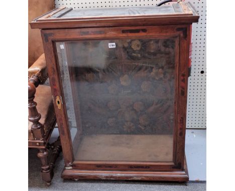 A 19th century continental marquetry and tortoiseshell inlaid tabletop display cabinet with single glazed door and floral pol