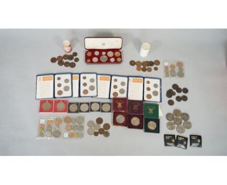 A collection of mostly British coins, including a 1953 ten coin specimen proof set with a Royal Mint case, four Britians Firs