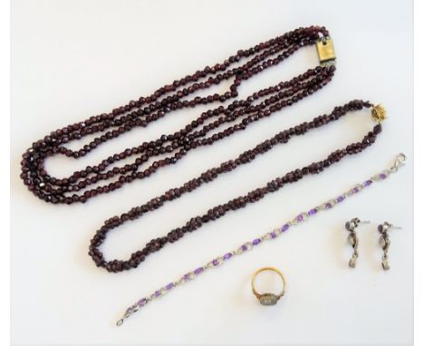 An oval Florentine micro-mosaic ring, in a floral design, ring size K, two garnet bead necklaces, a silver and amethyst brace