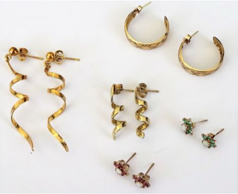 A pair of 9ct gold, ruby and opal cluster earstuds, a pair of 9ct gold, opal and green gem set cluster earstuds and three pai