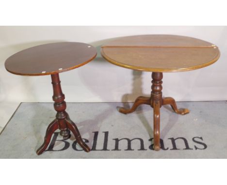 A 19th century mahogany tripod table on three outswept supports 87cm wide x 70cm high and another smaller, 61cm wide x 75cm h