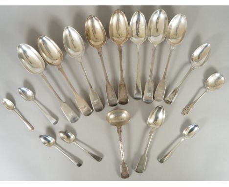 Silver table flatware, comprising; seven fiddle pattern tablespoons, one Old English pattern tablespoon, two dessert spoons, 