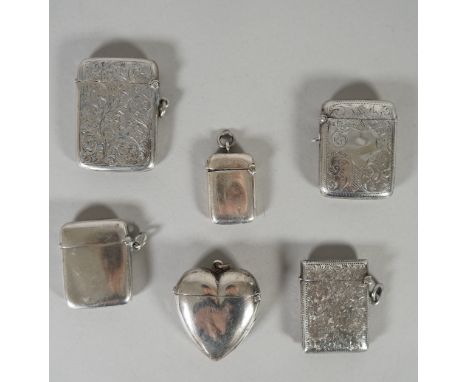 A Victorian silver heart shaped plain vesta case, Birmingham probably 1895, three rectangular vesta cases, having engraved de