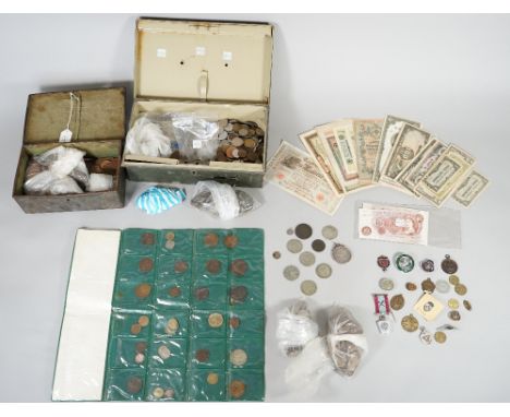 A quantity of British and foreign coins and banknotes, including a Victoria old head crown 1900, a circular copper medallion,