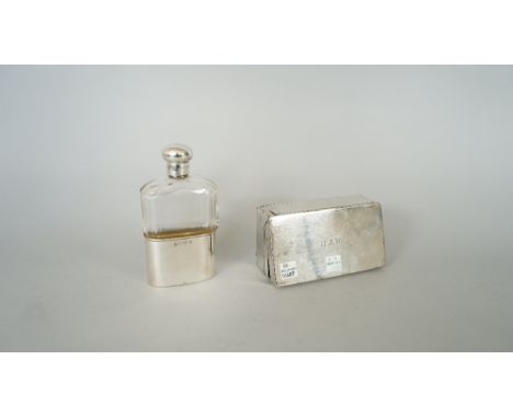 A silver mounted, faceted glass spirit flask, with a pull-off beaker base, Birmingham 1903 and a silver rectangular folding s