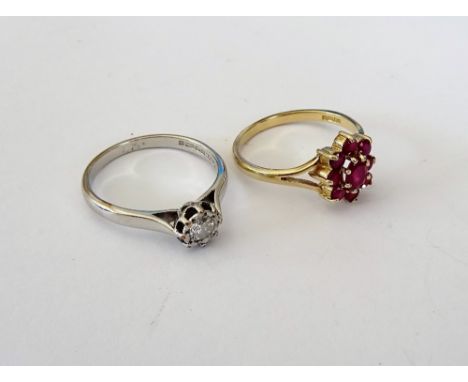 A 9ct white gold and diamond set single stone ring, mounted with a circular cut diamond, ring size P and a 9ct gold and ruby 