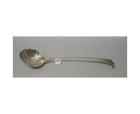 An early George III bottom marked silver soup ladle, in the onslow pattern, with shell bowl, London 1766, length 35.5cm.