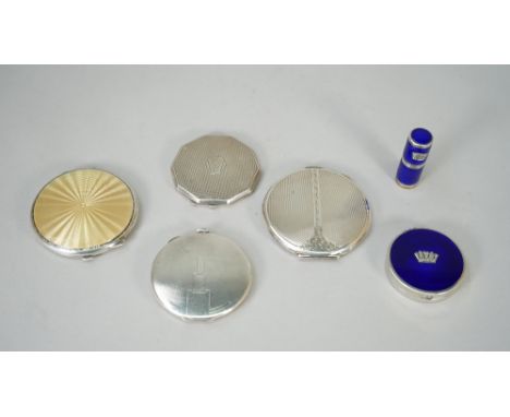 A lady's silver and buff coloured enamelled powder compact, Birmingham 1939, three lady's silver powder compacts, having enam