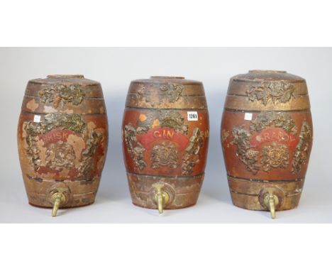 A set of three terracotta spirit barrels, late 19th century, 'Brandy, Whisky and Gin', each relief moulded with fruiting vine