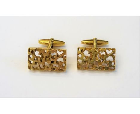 A pair of 9ct gold cufflinks, each with a rectangular front, having cast and pierced decoration and with folding bar fittings