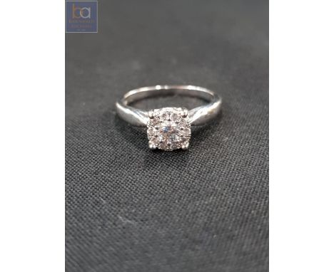 18 CARAT GOLD AND DIAMOND RING WITH CIRCA 0.33 CARAT OF DIAMONDS 