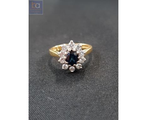 18 CARAT GOLD SAPPHIRE AND DIAMOND RING WITH 0.40 CARAT OF DIAMONDS 
