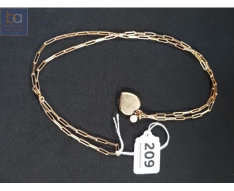 14 CARAT GOLD MOUNTED PEARL PENDANT, HEART LOCKET ON YELLOW METAL CHAIN 