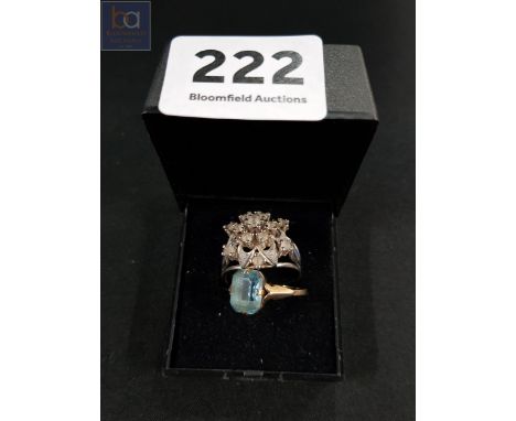 9 CARAT BLUE TOPAZ RING AND WHITE METAL RING 